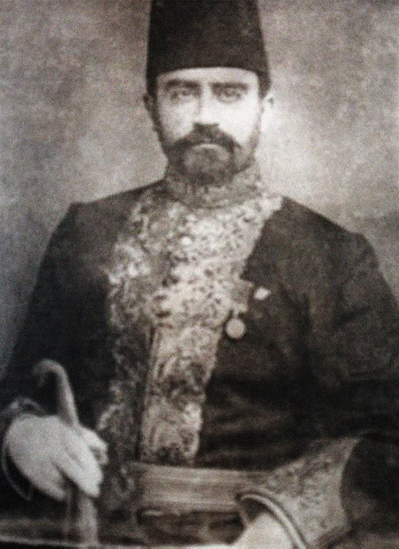 A portrait of Ahmed Ataullah Effendi, Abu Bakr Effendi's eldest son, in a fez and formal coat.