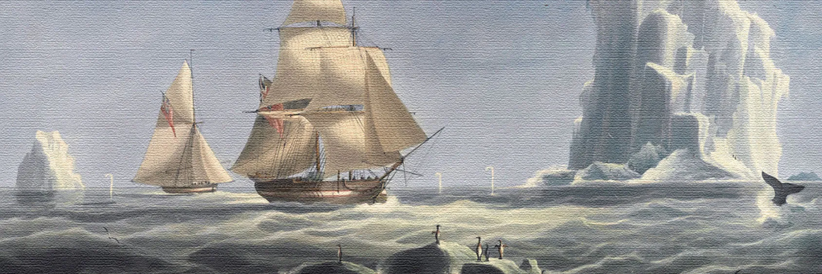 A wide photograph of an expedition party crossing the Antarctic ice toward distant mountains.
