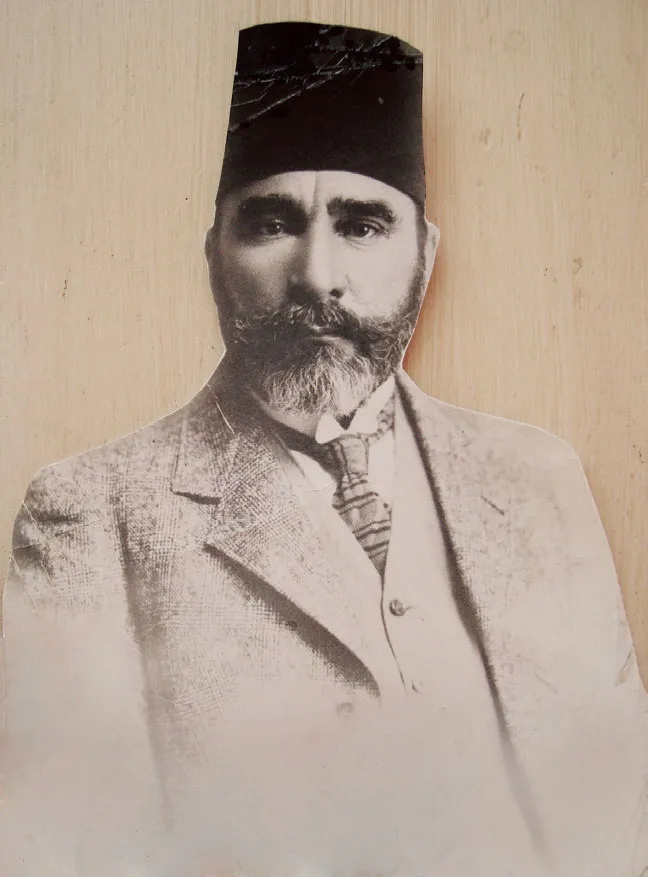 A portrait of Hisham Nimetullah Effendi, a bearded scholar in a fez, son of Abu Bakr Effendi.